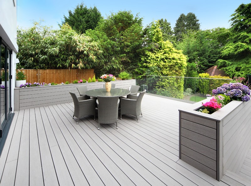 Grey garden deck with flowers in deck planter